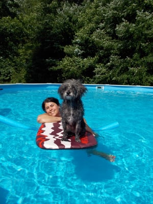 Lissette hanging out with Sake in the pool.