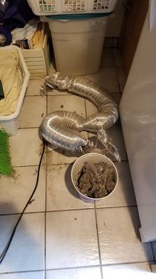 Replacing a dryer exhaust vent and clearing a clog.