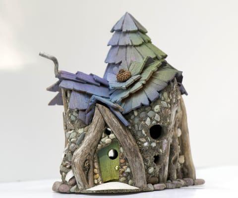 Created with driftwood and whimsy! The doors of our houses open, so you can enter a dream space!