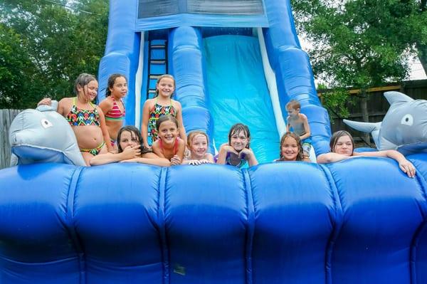 All these kids had a good time on our dolphin water slide.