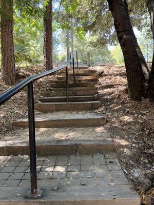 Steps the upper area of grounds area leading to the dorms/bunks/rooms