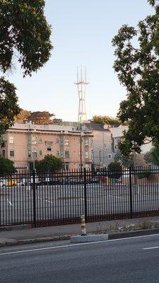 View of the tower from Fell Street, with the DMV parking lot in the foreground.