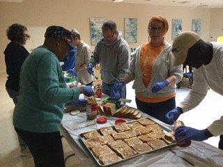 St. Aidan's making peanut butter and jelly sandwiches for Crossroads Ministries.