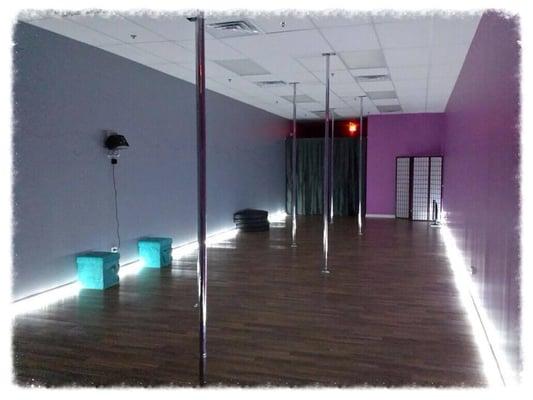 Our studio boasts 7 spinning/static poles, beautiful floors, and fun colors and lights!