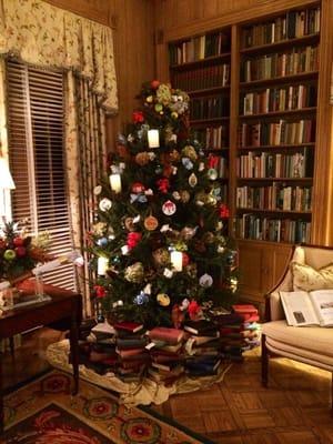 Love the creative use of books around the base of the trees in the library for Christmas 2014.