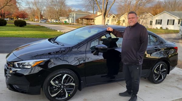 2024 Nissan Versa with all the amenities.  This is what a happy camper looks like!