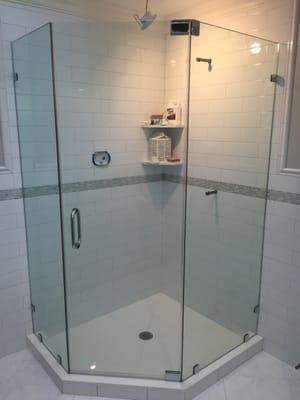 Truly a Frameless Neo-Angle Shower Enclosure with NO HEADER. Installed by Aquarius.