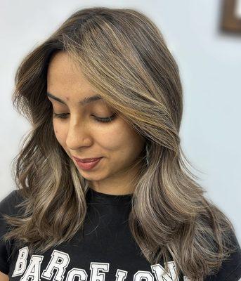 Hair Color And Highlights With A Sleek Blowout