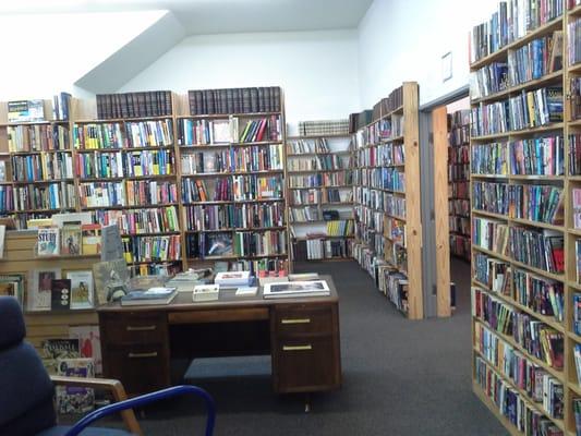 5 views of the new store in relation to the round counter that used to be at Shakespeare Books in its E Dallas locations in the 80-90's