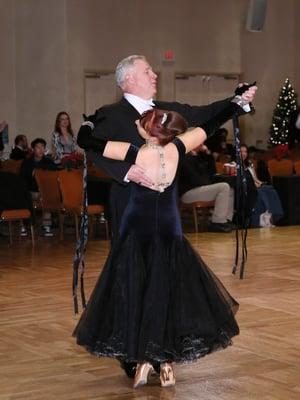 Student Ed Larkin and instructor Jennifer Corey dressed to impress, and gliding across the floor.