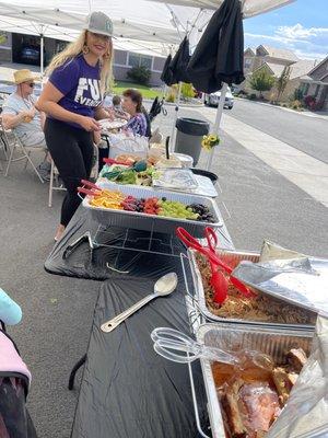 Owner Heidi, at the food table...beautifully displayed!