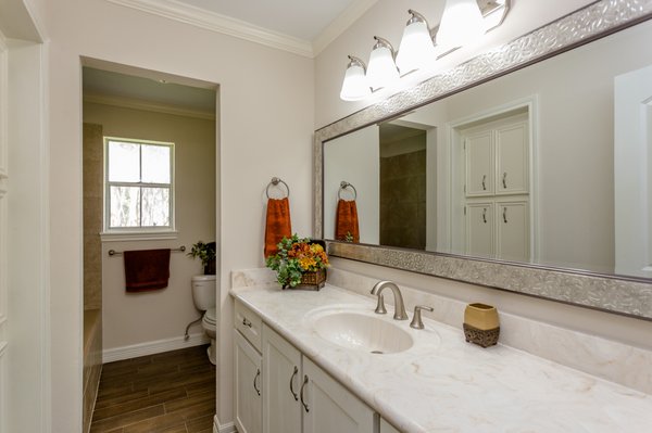 Complete bathroom remodel. New counter tops, cabinets, flooring, shower, paint, hardware and lighting.