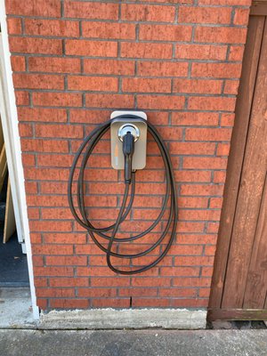 ChargePoint charging unit on brick wall.