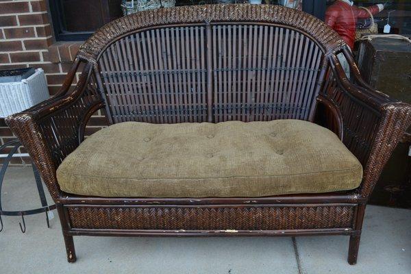 Great for a covered porch! Older Pier 1 Bamboo/rattan loveseat.