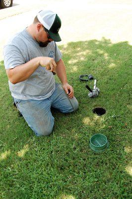 Jacob West from H2O Sprinkler Systems getting down in the dirt.