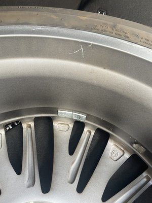 "X" gouged into new aluminum wheel