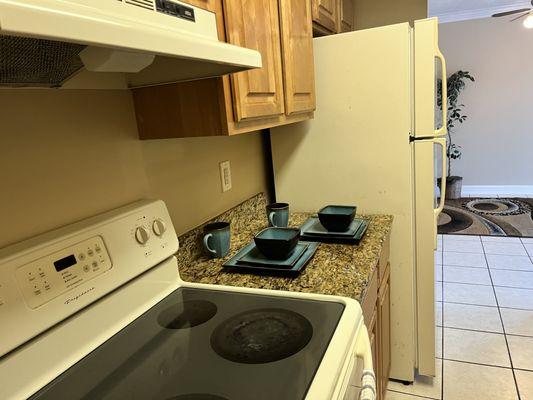 Granite counters and hardwood cabinets