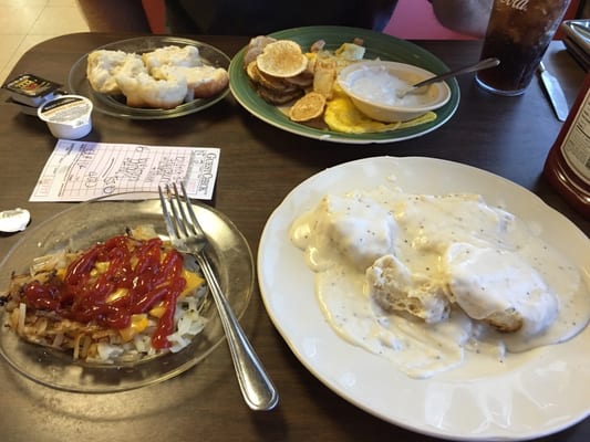 Western omelette, hashbrowns smothered and covered, biscuits and gravy, and home fries.