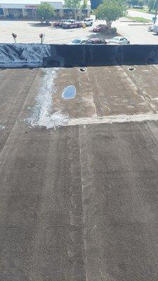 Roof leak located and repaired prior to roof coating.