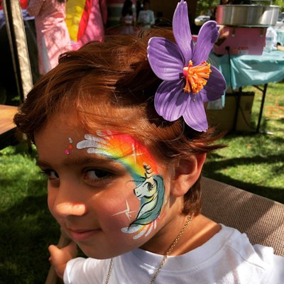 Easy and Fast Unicorn and Rainbow Cheek Art by Snappy Face Painting located in Denver CO