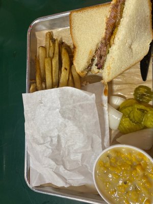 Brisket sandwich, fries, and cream corn