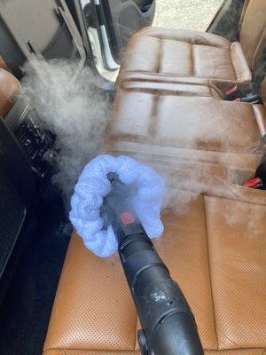 Steam cleaning the interior of a 2016 Jeep SRT.