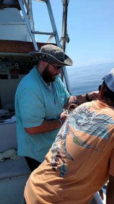 Josh helping reel in a red snapper