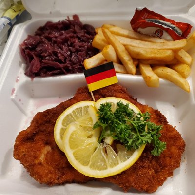 Schnitzel Wiener Art with fries and red cabbage