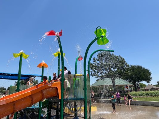 Kids enjoying the summer cool downs in the park