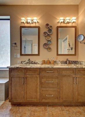 A master bath with dual sinks and drawer storage.