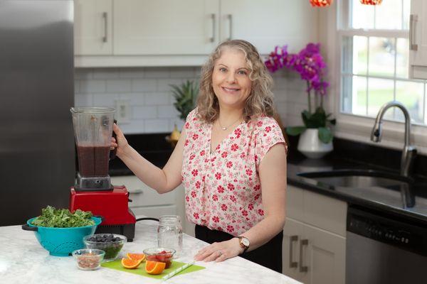 Making a smoothie RDN and certified health coach Carolyn Bouquot,