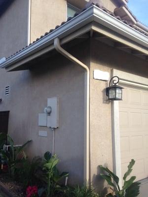 Gutters matched to fascia boards, down spouts matched to stucco.