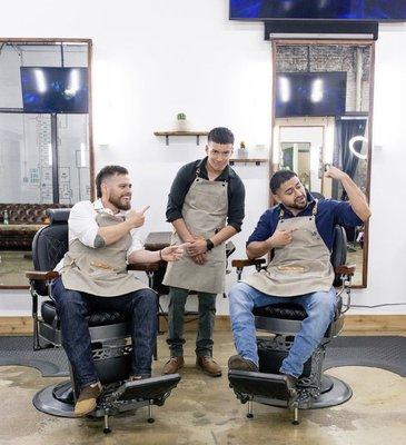 3 of the main Barbers. The two sitting are the owners.