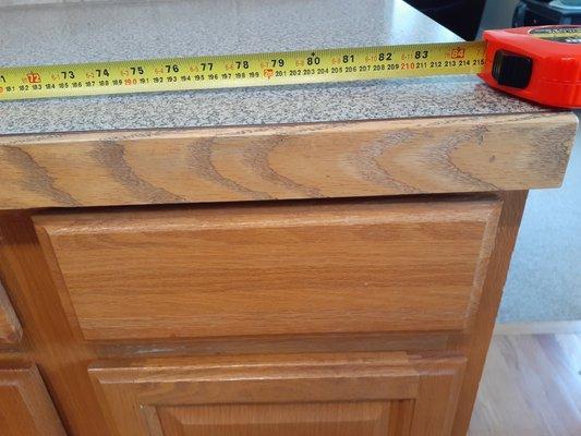 Tape measured cabinet area  showing exact length sent to Milestone David Gerdes.