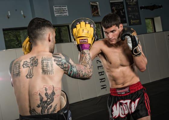 Coach Mark works with Muay Thai fighter Rob Castillo