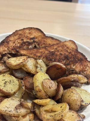 Tuna sandwich with fried potatoes.