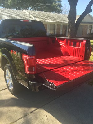 They did the tint and did a custom red Kevlar bed liner. 2015 F150 Platinum.