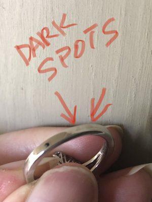 Dark spots after I had a very fine white gold ring sized by Littleton Jewelry. Poor workmanship.