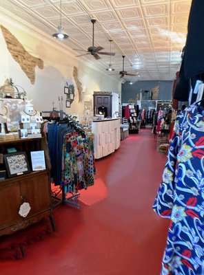 Enjoy this gorgeous building's original tin ceiling tiles, exposed brick walls and striking red concrete floor.  Beautiful space!