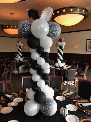 Balloon centerpiece tower with feathers.