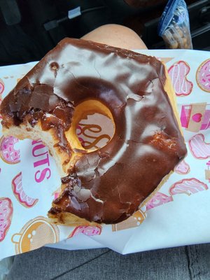 Chocolate donut real lite on frosting.. other donuts loomed worse on frosting...barely covered donuts. Hardened texture donuts