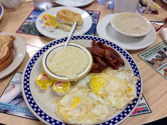 Eggs and bacon with grits and biscuit.  Added side of sausage gravy.  Very good!