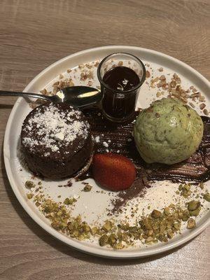 Chocolate soufflé.   Molten chocolate lava cake served with pistachio ice cream.