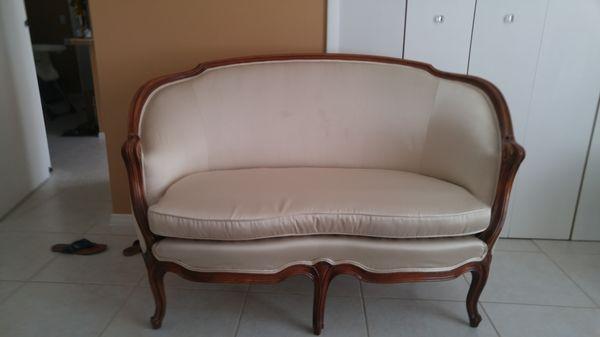 Love seat settee 63"
 Recently Upholstered.
 With striped patterned on reversed seat cushion.
 Great condition.