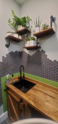 Custom interior design featuring new tile, bench, and wall art.