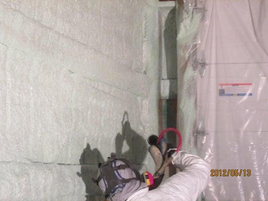 Application of closed cell spray foam insulation to garage pole building.