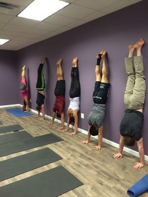 Belly to wall handstands will help you build strength while working on your endurance.