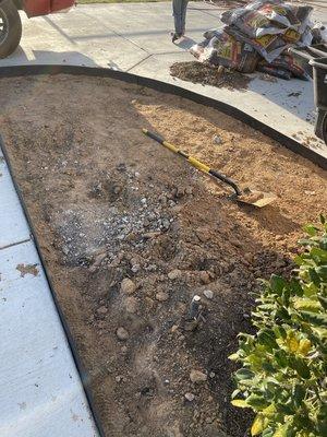 Removing excess dirt in garden bed