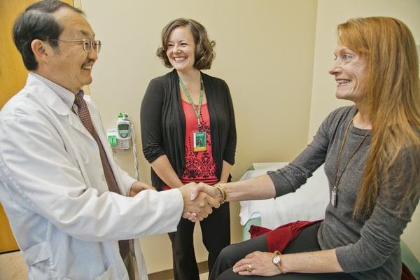 Naturopathic doctor with student observing