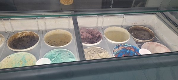 1 of 3 freezers of various ice cream (superman on bottom right, 2nd from right)